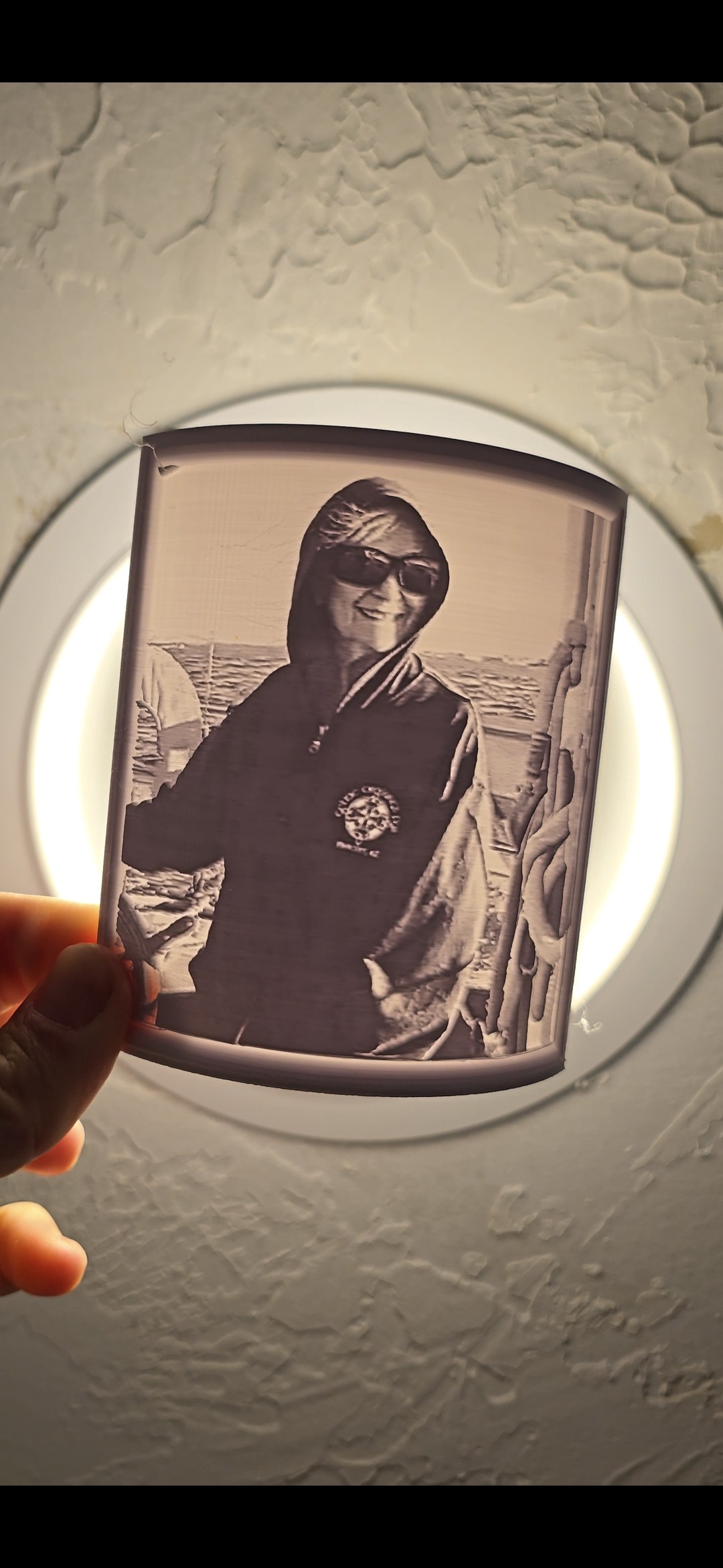 Memory Light after being plugged in — the photo glows to life with warm light revealing the image